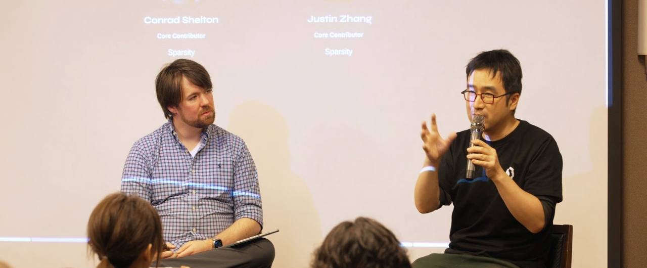 Justin (right) and Conrad from Sparsity shared their vision on scalable computation for AI-driven decentralized systems.
