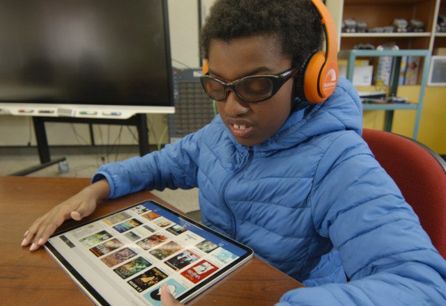 Boy reading on Bookshare