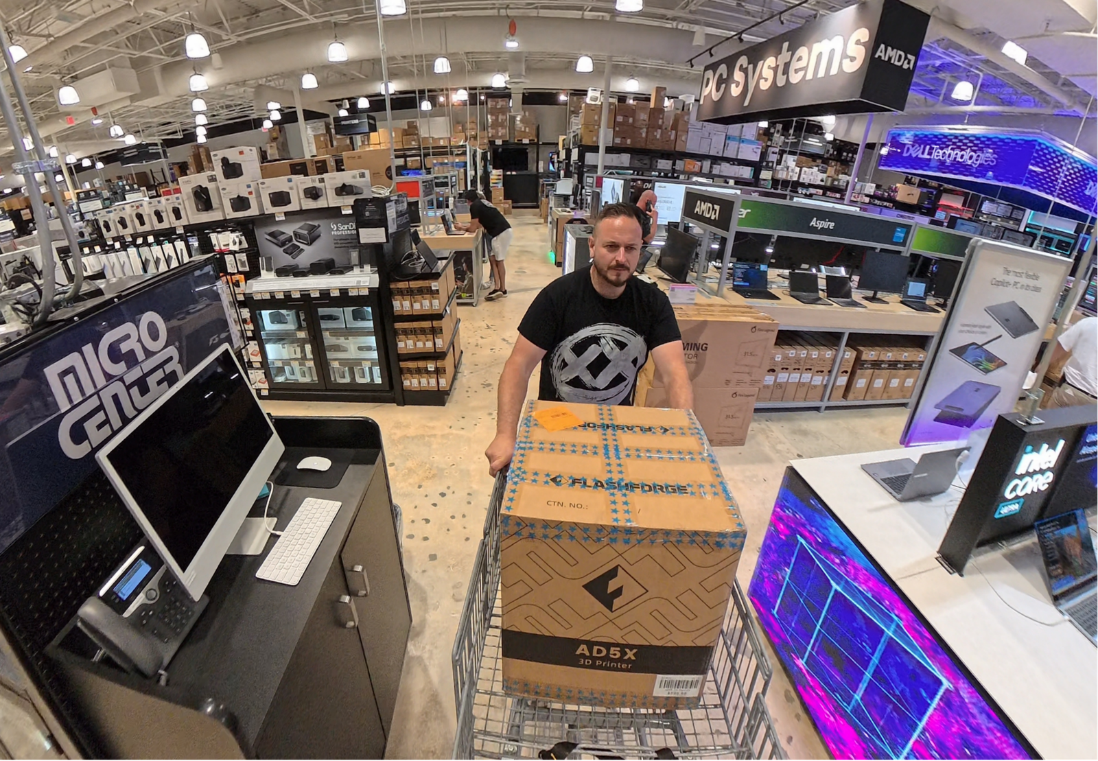 A man purchasing the Flashforge AD5X Multi-Color FDM 3D Printer at Micro Center