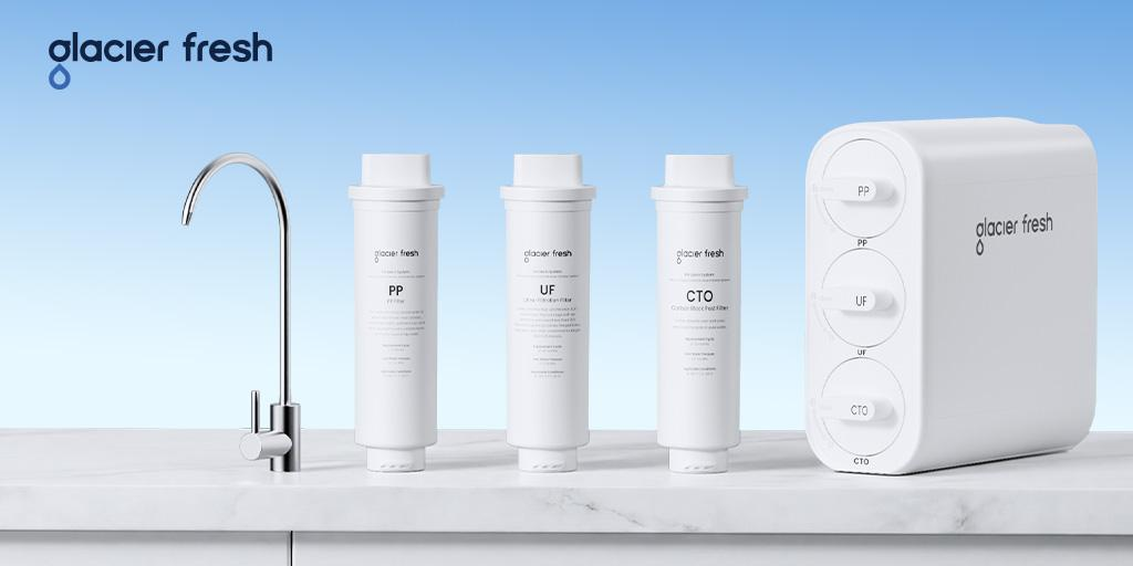 Glacier Fresh U06 Under Sink water filter and a glass of clean water